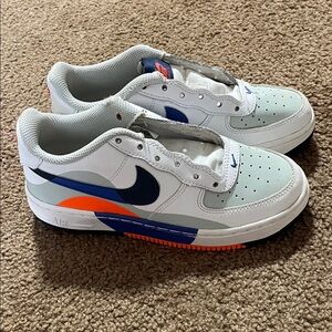 Nike Kids White and Navy Sneakers with Orange Accents